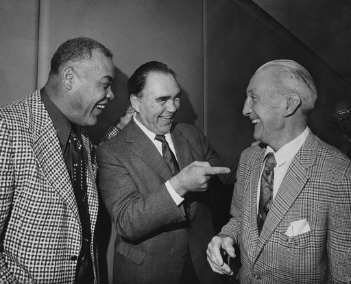Former heavyweight champions Joe Louis, left, and Max Schmeling, center, share a laugh with former referee Arthur Donovan. (AP Photo/John Rooney)